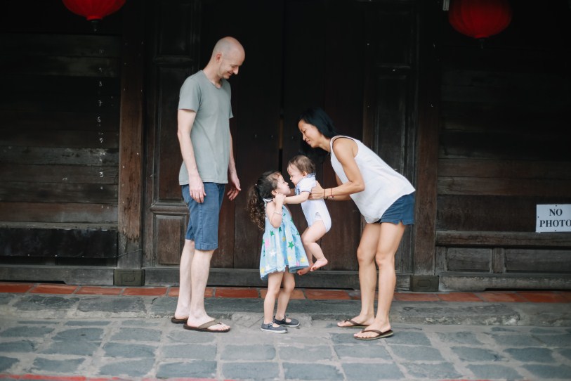 happy family in hoian taken by vietnamese family photographer